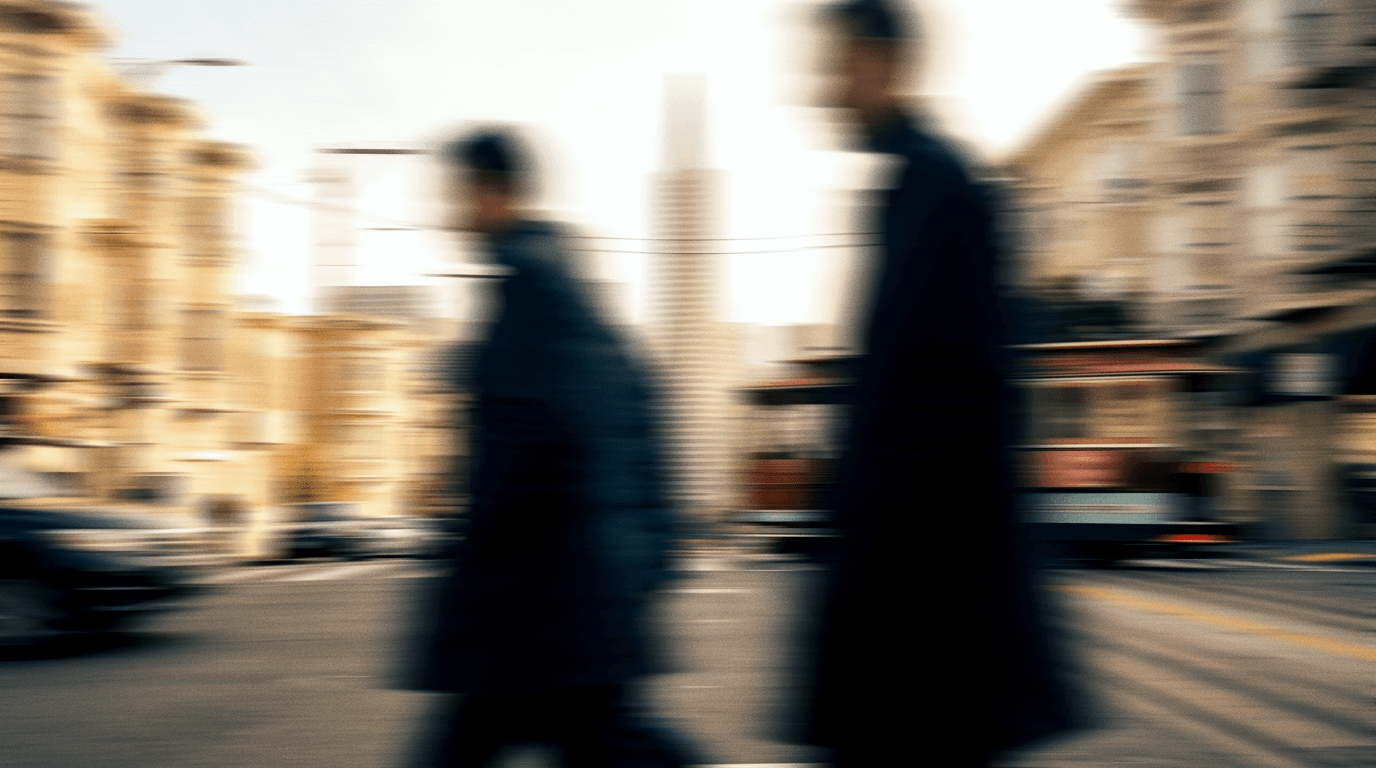 People walking along a San Francisco street, blurred in motion