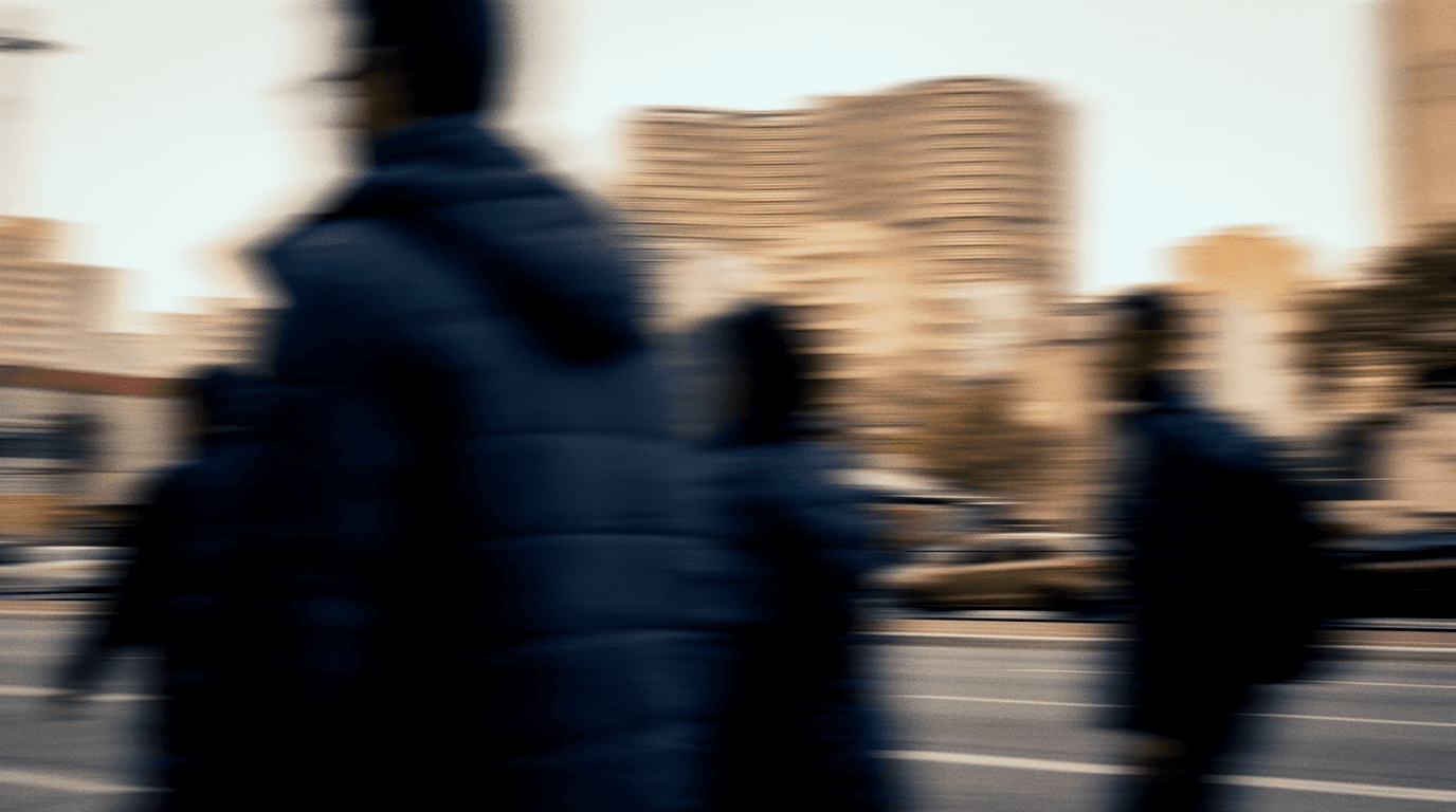 People walking along a São Paulo avenue, blurred in motion